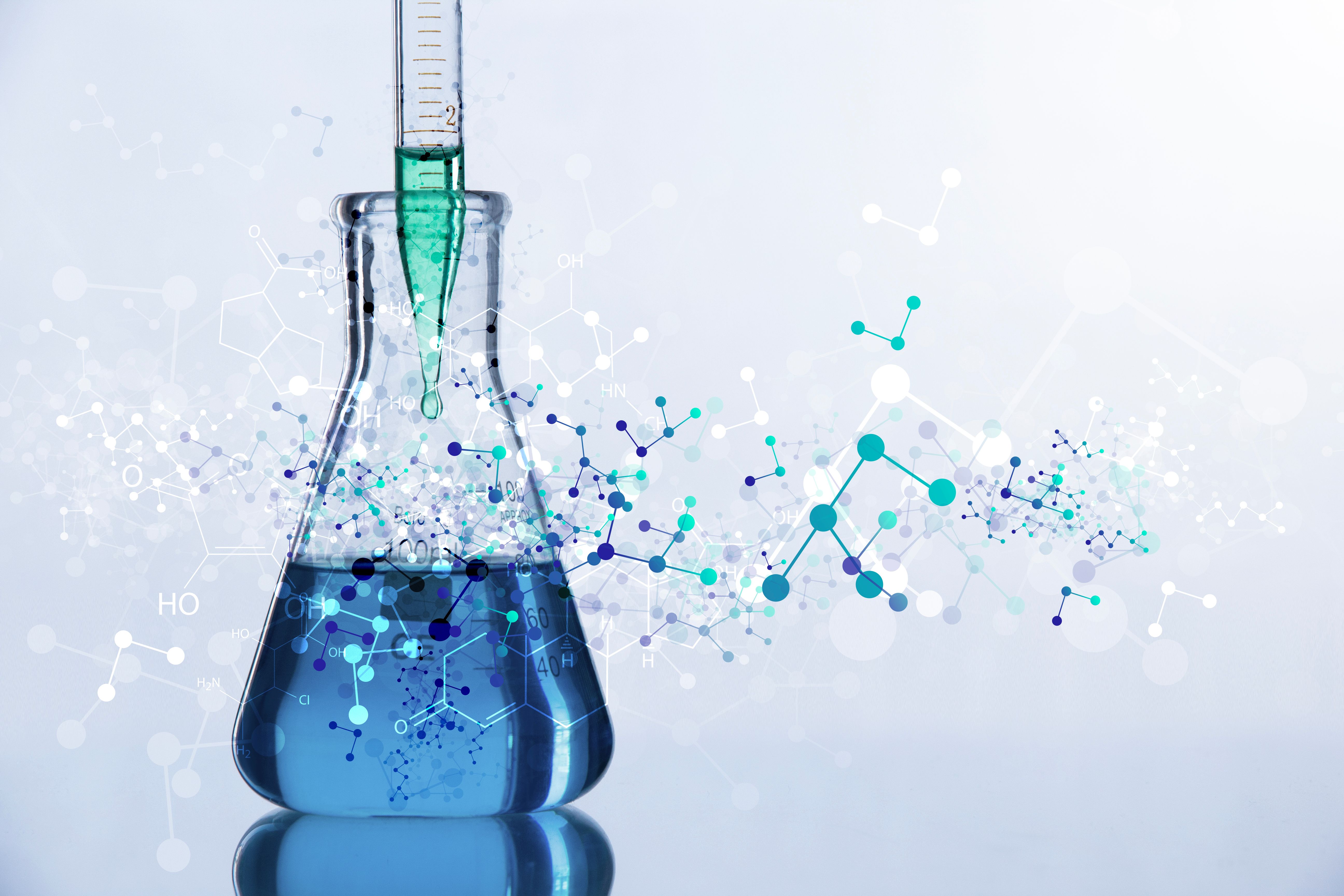 Erlenmeyer flask with structural formulas in the foreground.