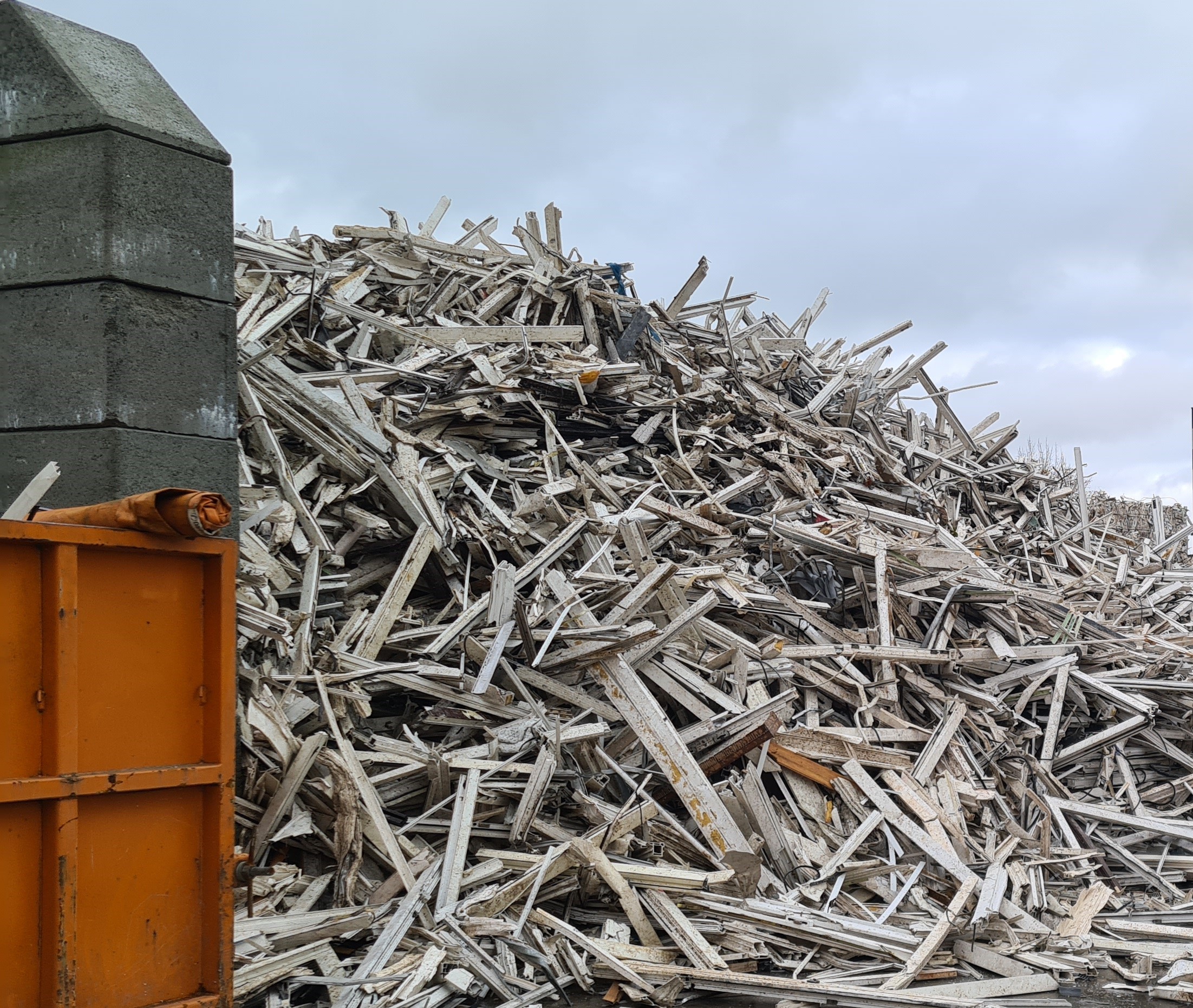 Old window frames at a recycling yard.
